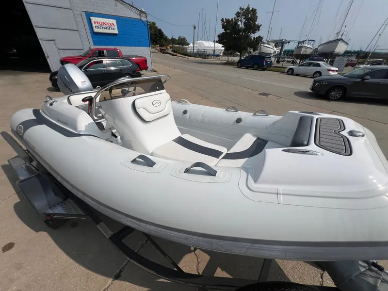 Slide: The Image of 2022 Walker Bay Generation 400 inflatable boat on trailer at marina. - 7