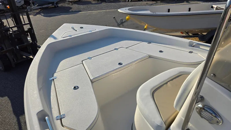 Slide: The Image of 2025 Bulls Bay 2000 boat deck with seating and storage compartments. - 10
