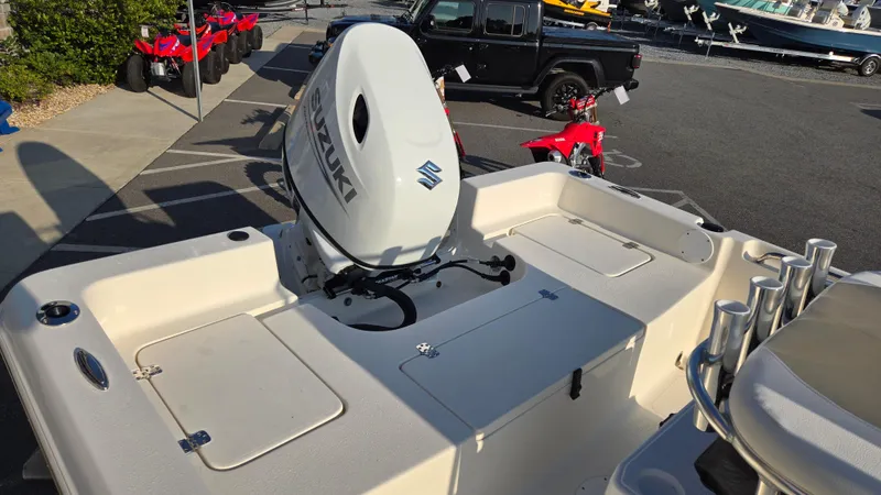 Slide: The Image of 2025 Bulls Bay 2000 boat with Suzuki outboard motor in a showroom. - 7