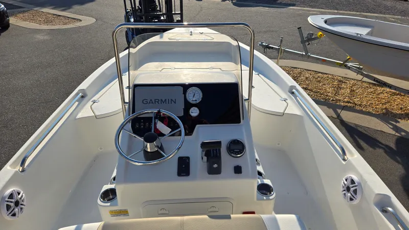 Slide: The Image of 2025 Bulls Bay 2000 boat dashboard with Garmin navigation system and steering wheel. - 9