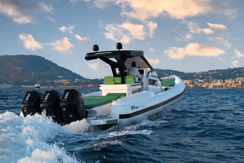Slide: The Image of Panamera Yacht PY 110 Veloce 2025 cruising on open water, scenic coastal backdrop. - 12