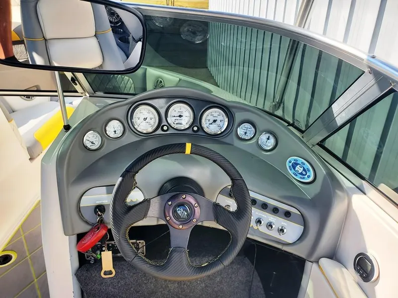 Slide: The Image of 2002 Moomba Mobius LSV dashboard with steering wheel and gauges. - 10