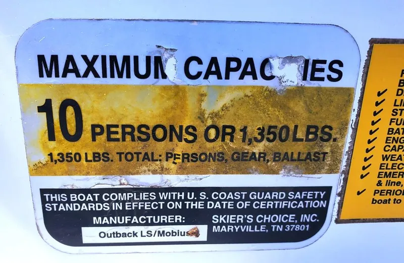 Slide: The Image of 2002 Moomba Mobius LSV capacity label, 10 persons or 1,350 lbs, safety compliance. - 13