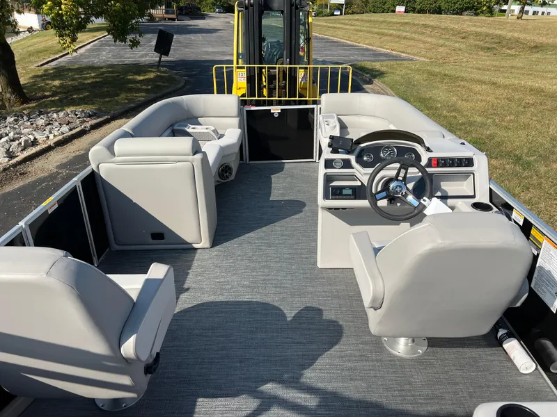 Slide: The Image of 2025 Godfrey Xperience 2286 SBX pontoon boat interior with seating and steering console. - 17