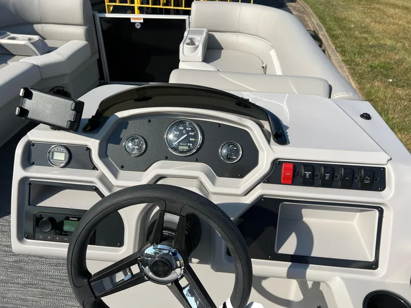 Slide: The Image of 2025 Godfrey Xperience 2286 SBX boat dashboard with steering wheel and controls. - 19
