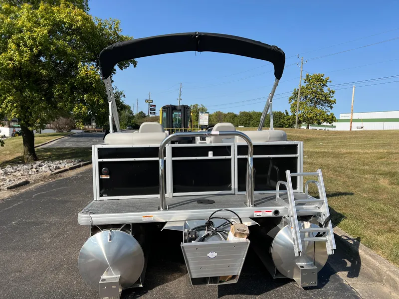 Slide: The Image of 2025 Godfrey Xperience 2286 SBX pontoon boat, rear view, parked on pavement. - 4