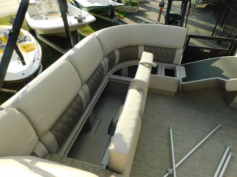 Slide: The Image of 2018 Bennington 25 R pontoon boat with spacious seating and storage compartments. - 12