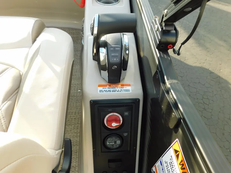 Slide: The Image of Control panel of a 2018 Bennington 25 R boat with throttle and warning labels. - 22