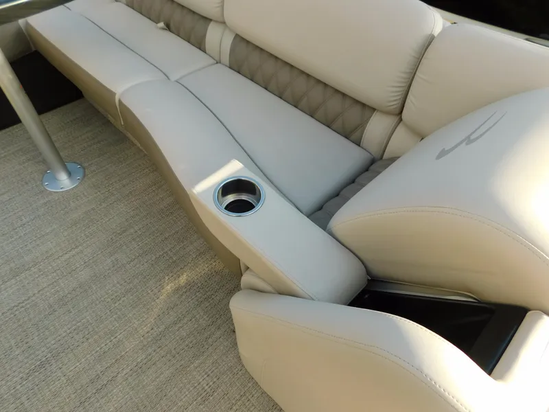 Slide: The Image of Luxurious seating on 2018 Bennington 25 R boat with cup holder and beige upholstery. - 27