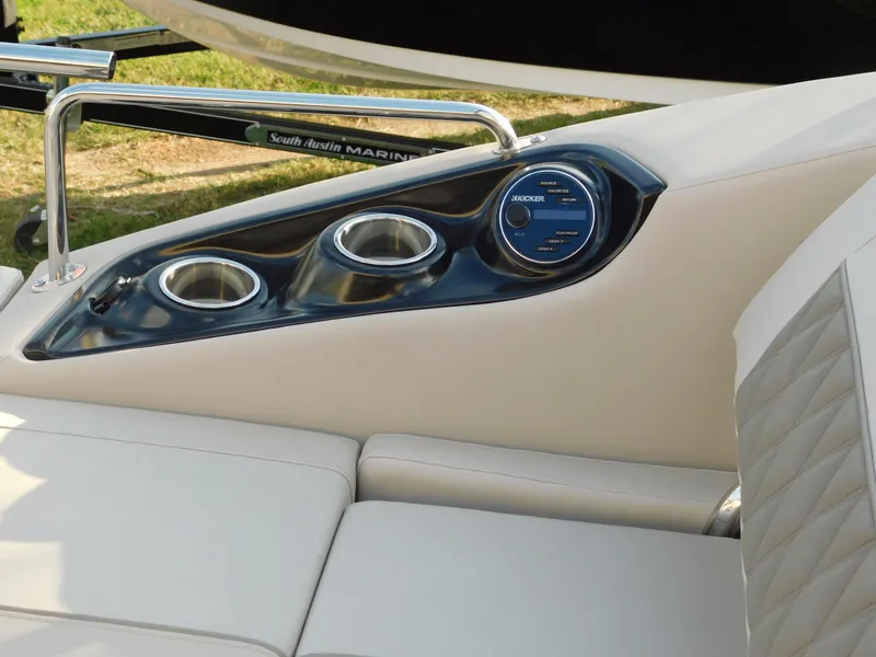 Slide: The Image of 2018 Bennington 25 R boat interior with cup holders and audio controls. - 31