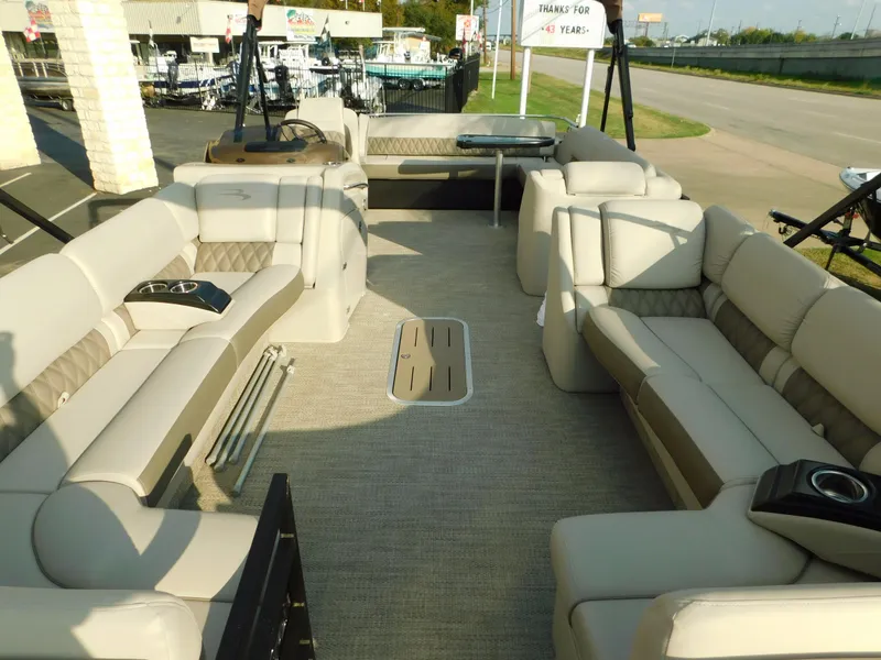 Slide: The Image of 2018 Bennington 25 R pontoon boat interior with spacious seating and cup holders. - 8