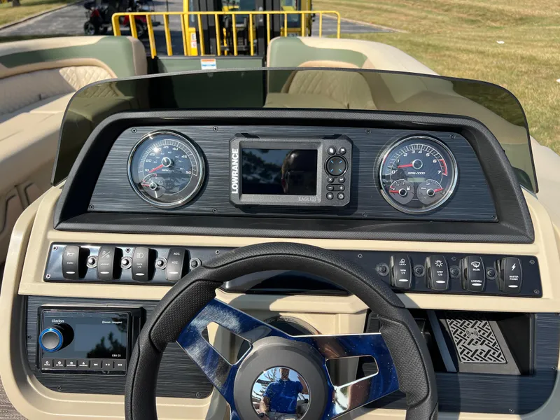 Slide: The Image of Dashboard of 2025 Godfrey SWEETWATER 2286 MT boat with gauges and controls. - 21