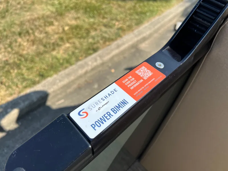 Slide: The Image of SureShade Power Bimini label on Godfrey SWEETWATER 2286 MT, 2025 model. - 26