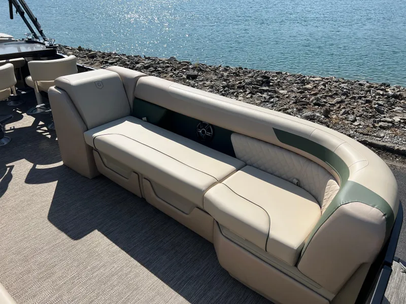 Slide: The Image of Luxurious seating on 2025 Godfrey SWEETWATER 2286 MT pontoon boat by the water. - 9