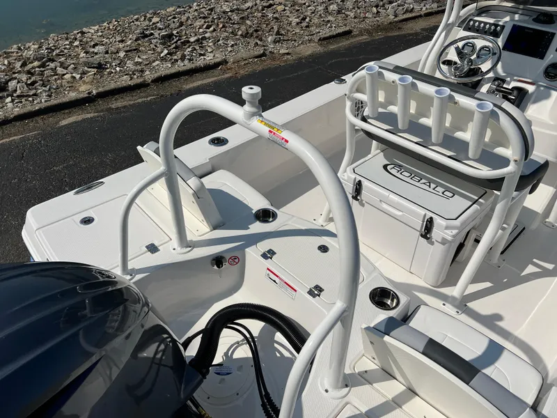 Slide: The Image of 2025 Robalo 206 Cayman boat interior with fishing rod holders and seating. - 10