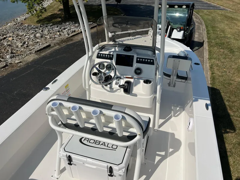 Slide: The Image of 2025 Robalo 206 Cayman boat interior with steering console and seating. - 11