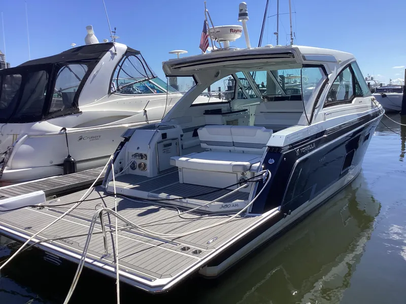 The Image of 2020 Formula 380 Super Sport Crossover yacht docked at marina, showcasing sleek design and spacious deck. - 0
