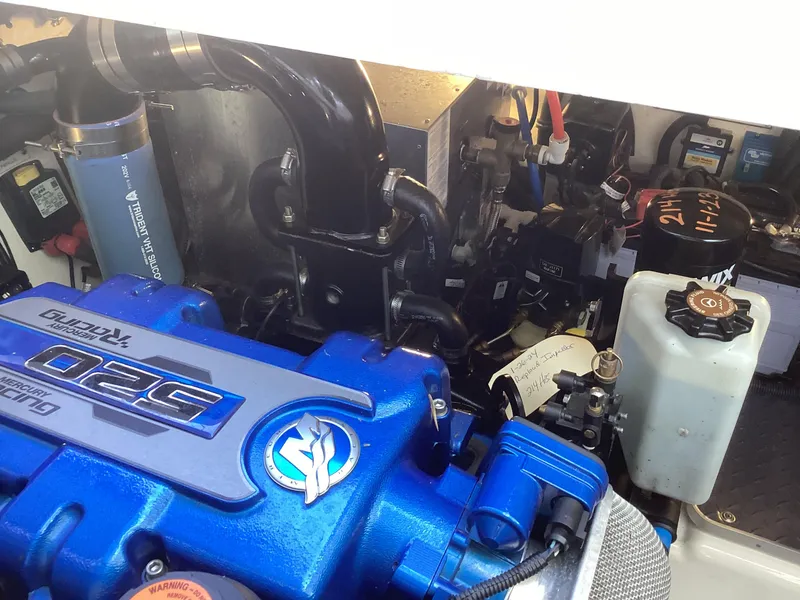 Slide: The Image of Engine compartment of a 2020 Formula 380 Super Sport Crossover with blue engine components. - 14