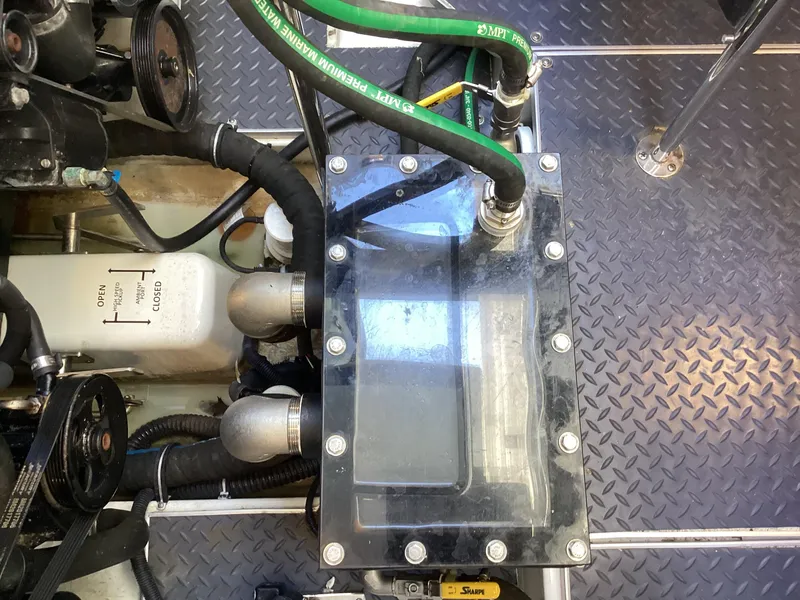 Slide: The Image of Engine compartment of 2020 Formula 380 Super Sport Crossover with visible hoses and components. - 15