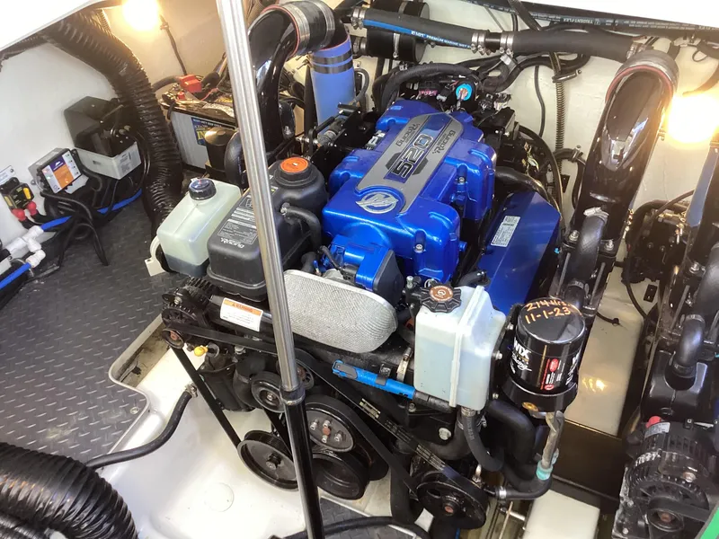 Slide: The Image of Engine compartment of a 2020 Formula 380 Super Sport Crossover boat, showcasing detailed components. - 19