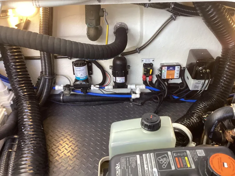 Slide: The Image of Engine compartment of 2020 Formula 380 Super Sport Crossover with hoses and components. - 20