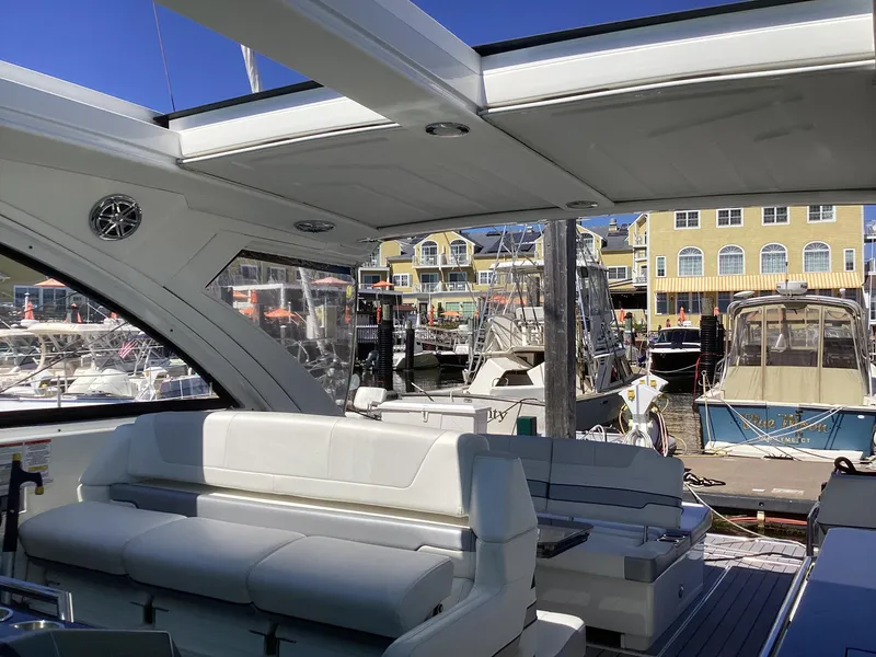 Slide: The Image of 2020 Formula 380 Super Sport Crossover yacht interior at marina, featuring luxurious seating. - 24