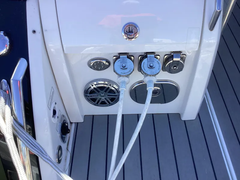 Slide: The Image of 2020 Formula 380 Super Sport Crossover boat deck with power connections and speaker. - 31