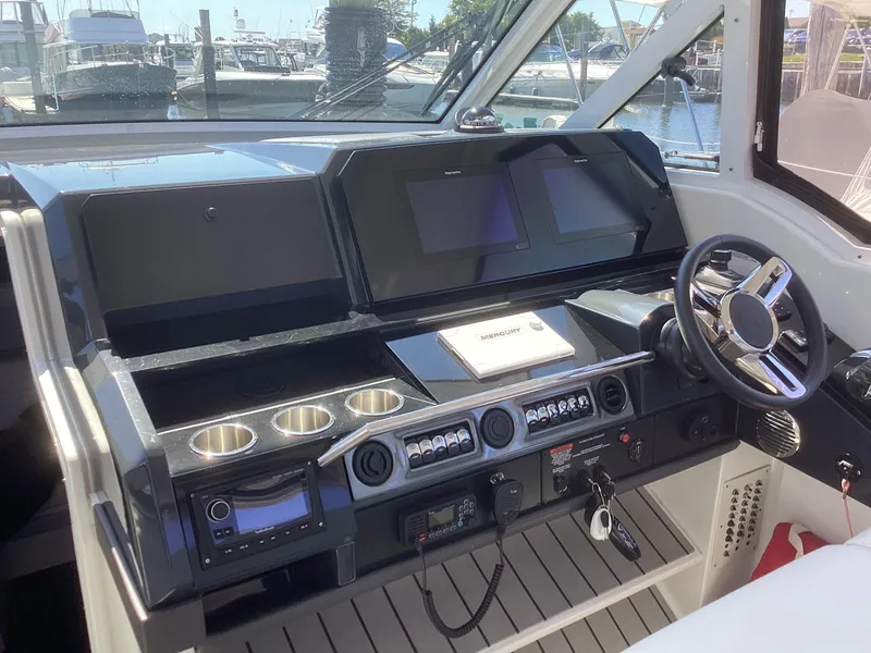 Slide: The Image of 2020 Formula 380 Super Sport Crossover helm with modern controls and sleek design. - 4