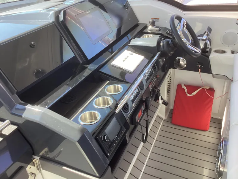 Slide: The Image of 2020 Formula 380 Super Sport Crossover helm with modern controls and cup holders. - 46