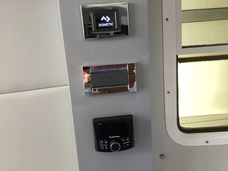 Slide: The Image of Control panel in a 2020 Formula 380 Super Sport Crossover boat interior. - 48