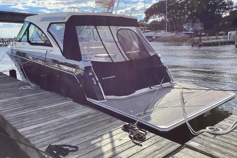 Slide: The Image of 2020 Formula 380 Super Sport Crossover I/O docked at marina, rear view. - 83