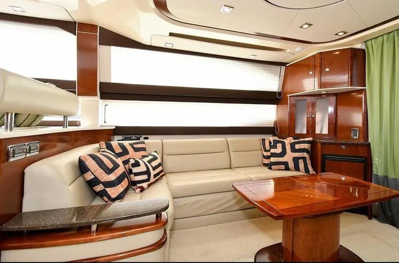 Slide: The Image of Luxurious interior of 2012 Meridian 441 Sedan yacht with plush seating and elegant wood finishes. - 12