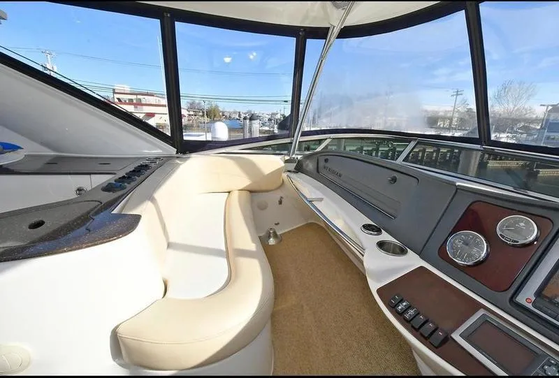 Slide: The Image of Interior of 2012 Meridian 441 Sedan yacht with modern dashboard and seating. - 15