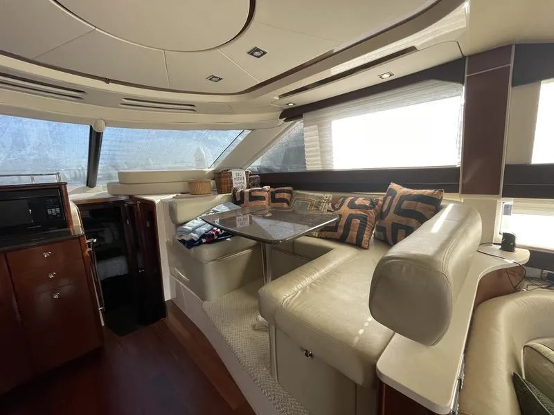 Slide: The Image of Luxurious interior of 2012 Meridian 441 Sedan yacht with plush seating and elegant decor. - 18