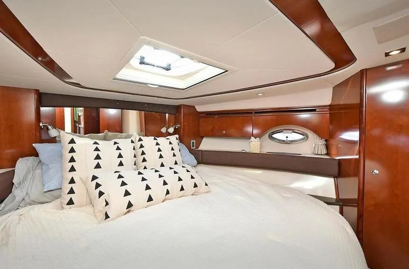 Slide: The Image of Luxurious bedroom interior of 2012 Meridian 441 Sedan yacht with elegant wood finish. - 20