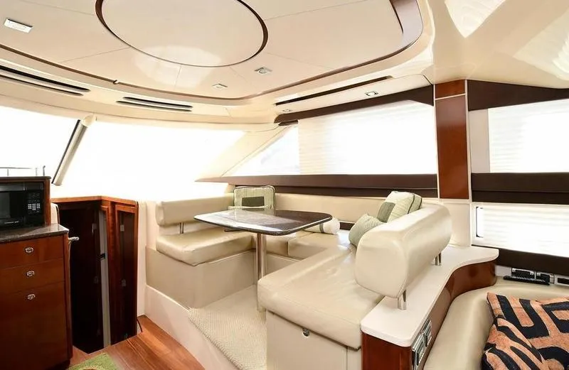 Slide: The Image of Luxurious interior of 2012 Meridian 441 Sedan yacht with elegant seating and dining area. - 24
