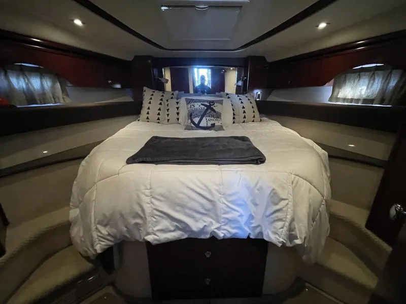 Slide: The Image of Luxurious bedroom interior of 2012 Meridian 441 Sedan yacht with cozy bedding. - 29