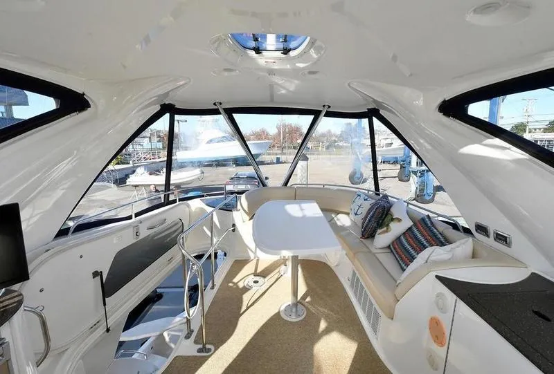 Slide: The Image of Interior of 2012 Meridian 441 Sedan yacht with spacious seating and panoramic windows. - 30