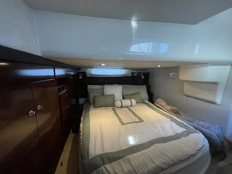 Slide: The Image of Luxurious bedroom interior of 2012 Meridian 441 Sedan yacht with cozy bedding. - 32
