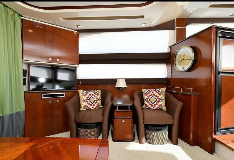 Slide: The Image of Luxurious interior of 2012 Meridian 441 Sedan yacht with plush seating and elegant wood finishes. - 33