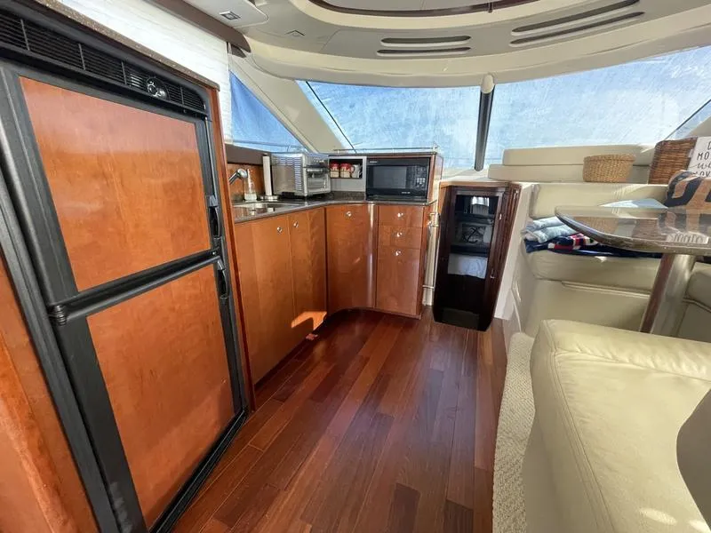 Slide: The Image of Luxurious interior of 2012 Meridian 441 Sedan yacht with modern kitchen amenities. - 34