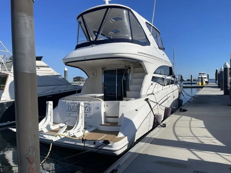 Slide: The Image of 2012 Meridian 441 Sedan yacht docked at marina under clear blue sky. - 42
