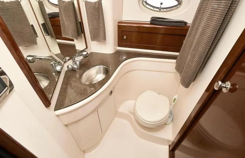 Slide: The Image of Luxurious bathroom in 2012 Meridian 441 Sedan yacht with sink and toilet. - 43