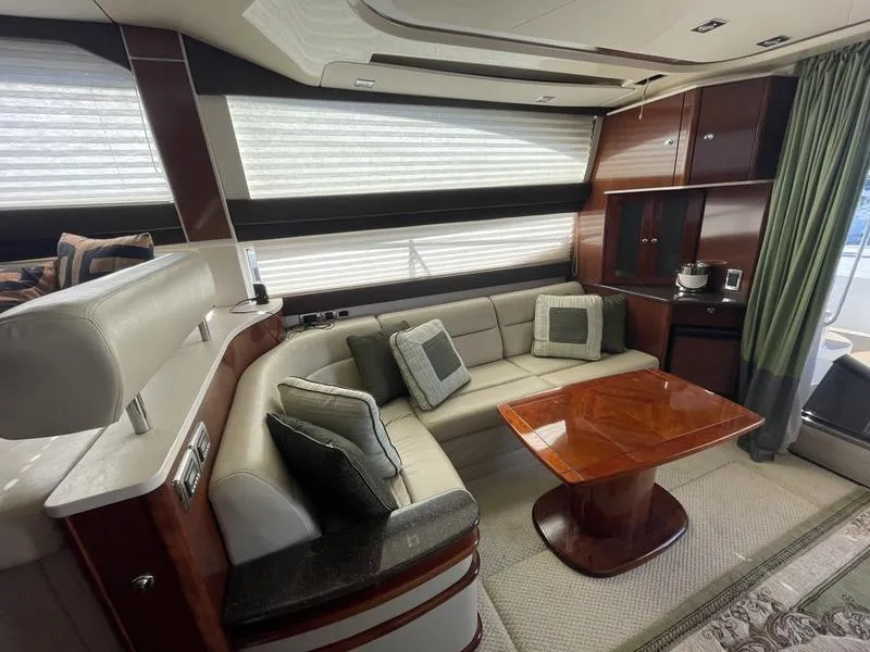 Slide: The Image of Luxurious interior of a 2012 Meridian 441 Sedan yacht with plush seating and elegant wood finishes. - 44