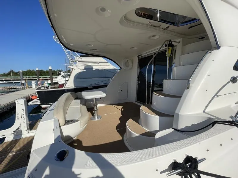 Slide: The Image of 2012 Meridian 441 Sedan yacht with spacious deck and seating area. - 46