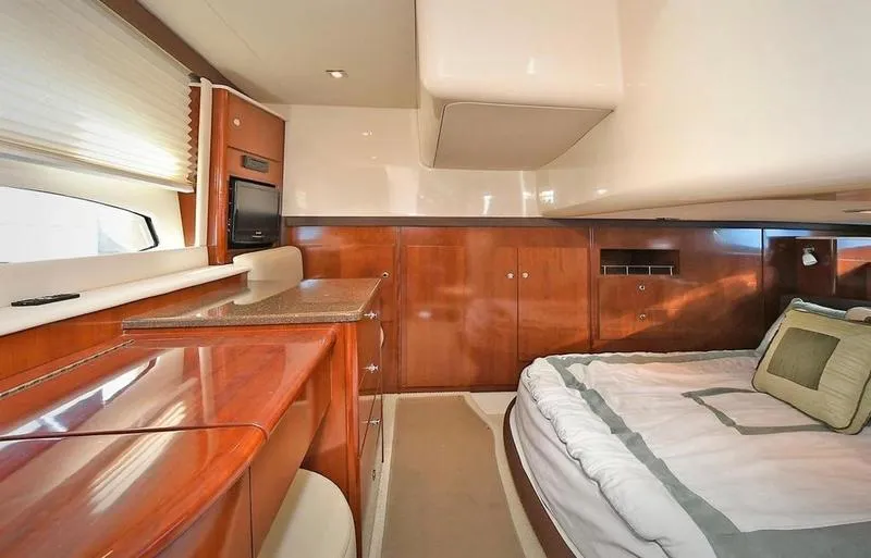 Slide: The Image of Luxurious interior of 2012 Meridian 441 Sedan yacht cabin with wood finishes. - 48