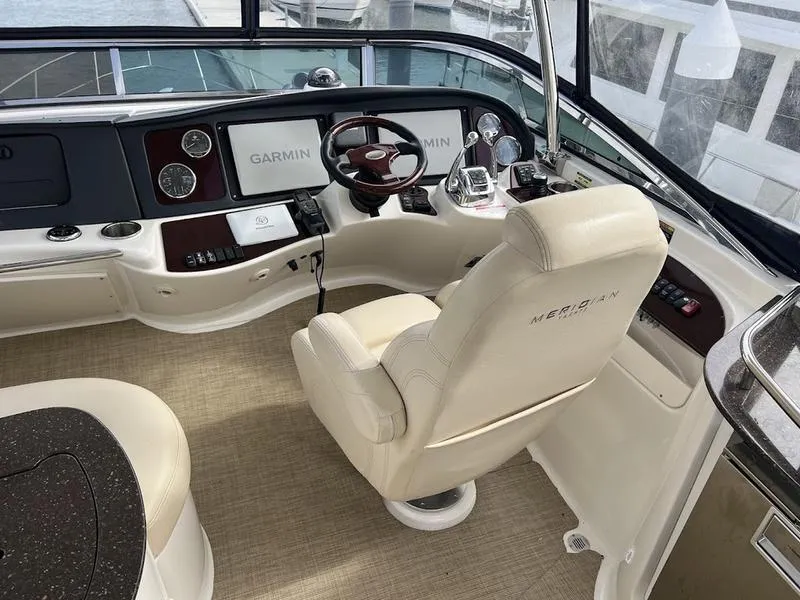 Slide: The Image of 2012 Meridian 441 Sedan helm with Garmin navigation and plush captain's chair. - 8