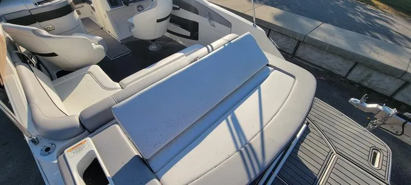 Slide: The Image of 2017 Sea Ray 220 SD boat interior with seating and deck view. - 23