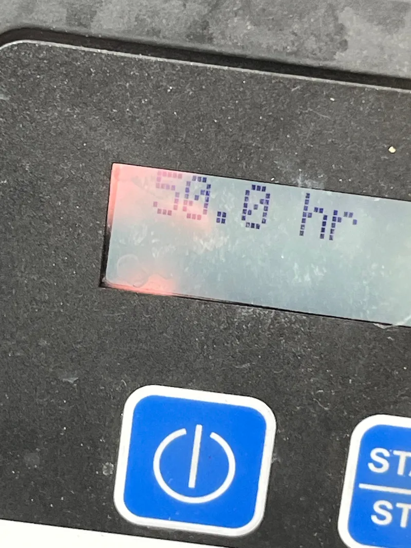 Slide: The Image of Close-up of a digital display showing 59.8 hours on a Formula 400 SS FX8, 2013 model. - 21