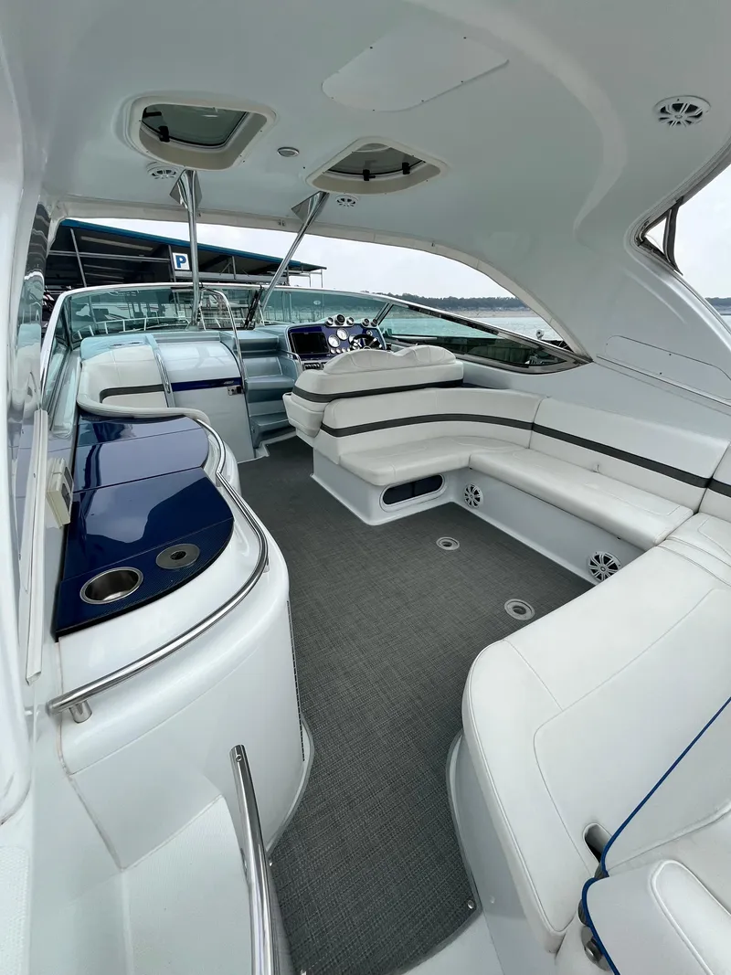 Slide: The Image of Interior of a 2013 Formula 400 SS FX8 boat with white seating and modern design. - 25